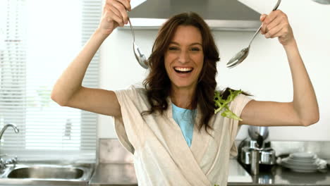 Woman-lets-fall-lettuce-while-preparing-a-salad