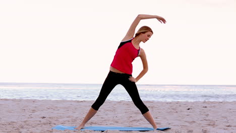 Woman-stretching-on-the-beach