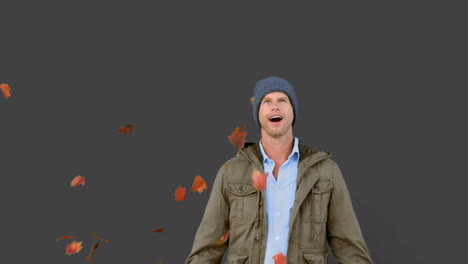 Amazed-man-looking-at-falling-leaves-on-grey-screen
