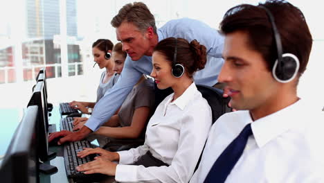 Smiling-business-people-working-in-a-call-centre