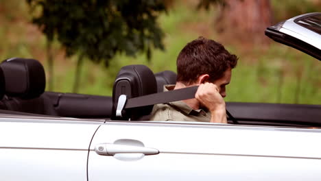 Man-in-a-convertible-car