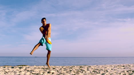 Attractive-man-catching-a-frisbee