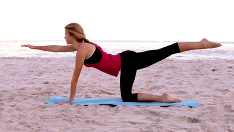 Blonde-woman-doing-pilates-stretches