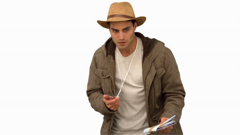 Man-orienteering-with-a-map-and-a-compass-on-white-screen