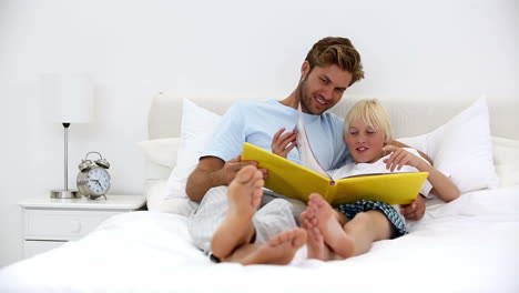 Father-and-son-reading-book-together