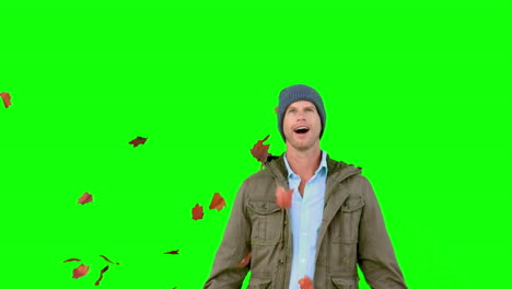 Amazed-man-looking-at-falling-leaves-on-green-screen