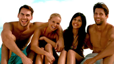 Friends-laughing-together-on-the-beach