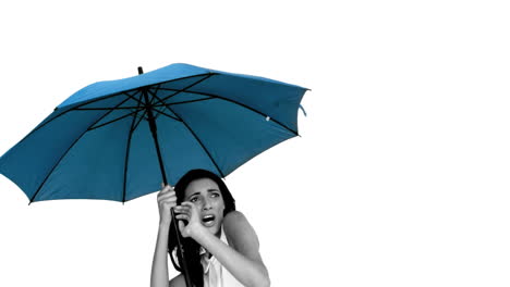 Woman-under-blue-umbrella-cowering-with-fear