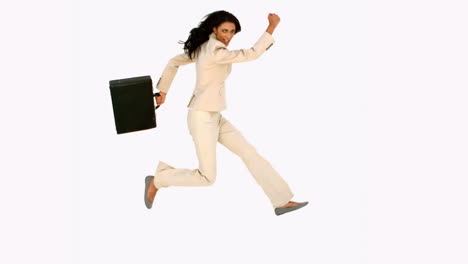 Businesswoman-jumping-with-her-suitcase