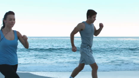 Attractive-couple-running-on-the-beach