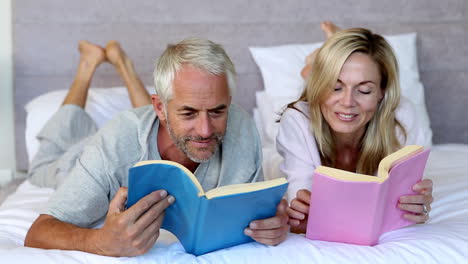 Couple-reading-books-in-the-bedroom-