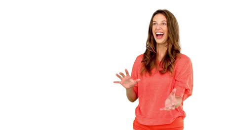 Smiling-woman-catching-a-basket-ball-on-white-background