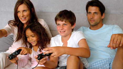 Family-playing-at-video-game