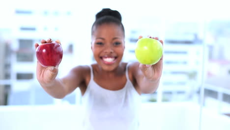 Cheerful-natural-model-holding-apples