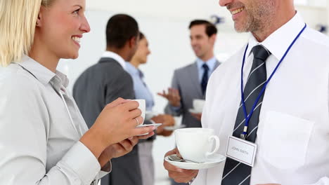 Business-people-chatting-during-coffee-break