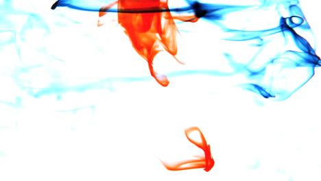 Blue-and-red-ink-swirling-in-water-on-white-background