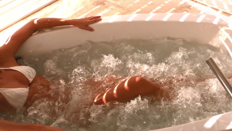 Laid-down-attractive-woman-in-a-jacuzzi