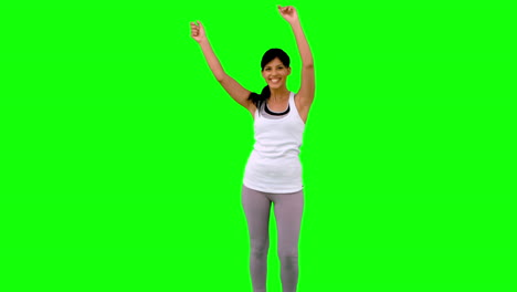 Woman-in-sportswear-dancing-on-green-screen