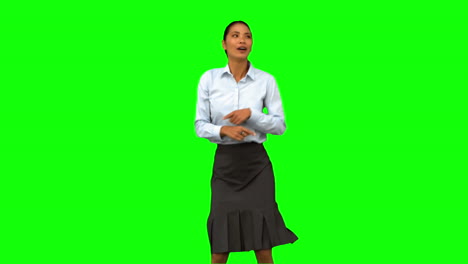 Cheerful-businesswoman-disco-dancing-on-green-screen