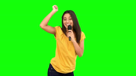 Woman-singing-and-dancing-on-green-screen