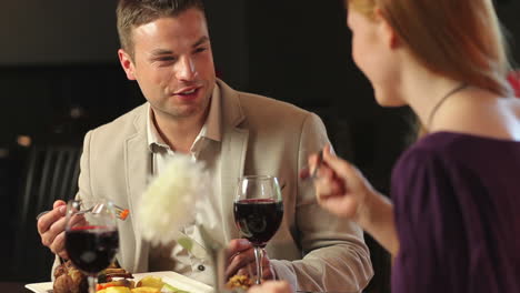 Attractive-couple-having-dinner-together-