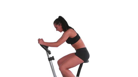 Tone-brunette-spinning-on-exercise-bike