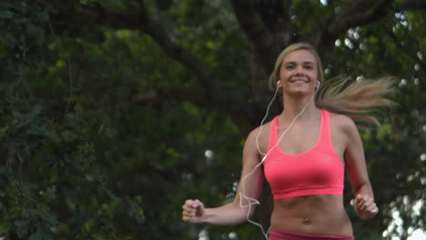 Happy-toned-blonde-running-in-park