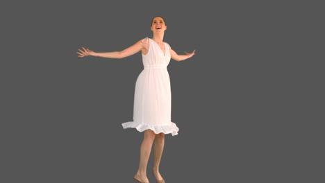 Elegant-woman-in-white-dress-turning-round