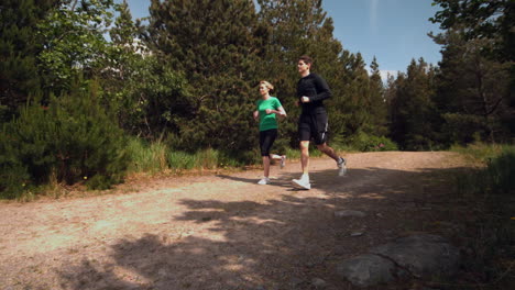 Athletic-couple-jogging-through-the-countryside