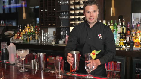 Handsome-bartender-making-cocktail