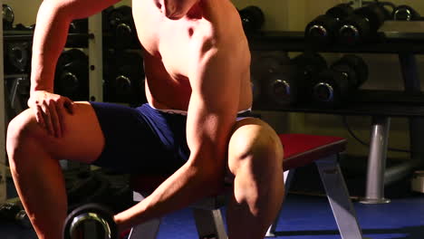 Attractive-fit-man-lifting-dumbbell