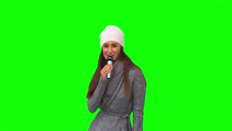 Happy-young-model-in-winter-clothes-singing