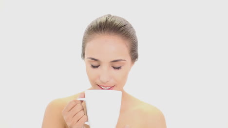 Beautiful-model-drinking-mug-of-coffee