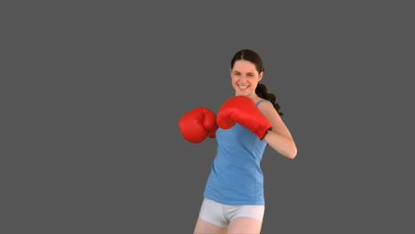 Victorious-young-model-with-boxing-gloves-posing