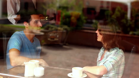 Couple-chatting-together-in-the-canteen-having-coffee