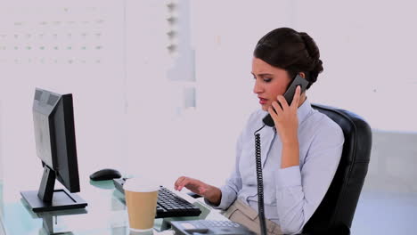 Concentrated-beautiful-businesswoman-making-a-phone-call