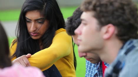Students-having-a-discussion-on-the-grass