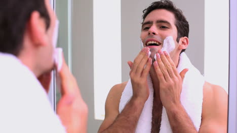Handsome-man-applying-shaving-foam
