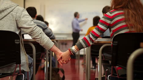 Students-holding-hands-in-class