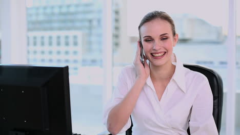 Smiling-businesswoman-having-a-phone-call