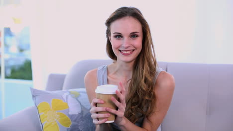 Happy-model-drinking-a-coffee-on-the-couch