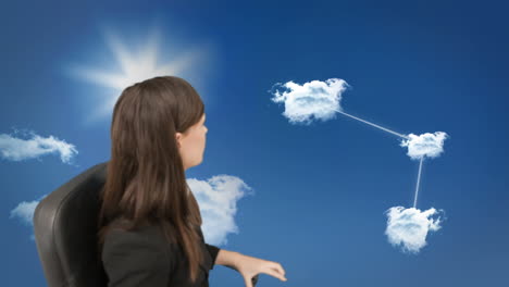 Concentrated-young-businesswoman-doing-cloud-computing