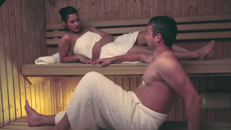 Couple-relaxing-and-chatting-together-in-a-sauna
