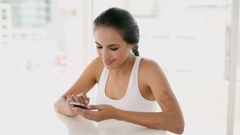 Beautiful-young-woman-texting-on-her-phone