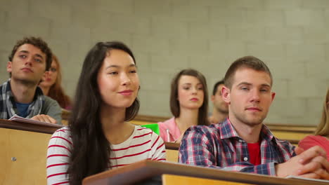 Students-listening-carefully-in-lecture-hall