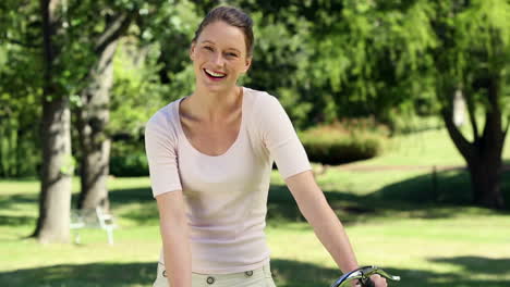 Pretty-girl-on-a-bike-ride-in-the-park
