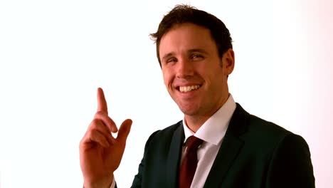 Happy-businessman-pointing-to-camera