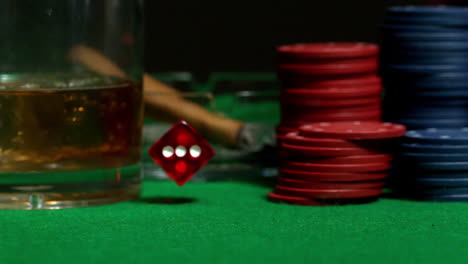 Red-dice-falling-on-casino-table