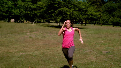 Fit-woman-sprinting-past-the-camera