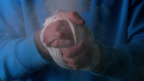 Young-boxer-clapping-his-wrapped-hands-together